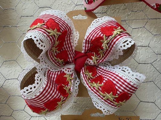 Red plaid bow with white lace and gold strawberry